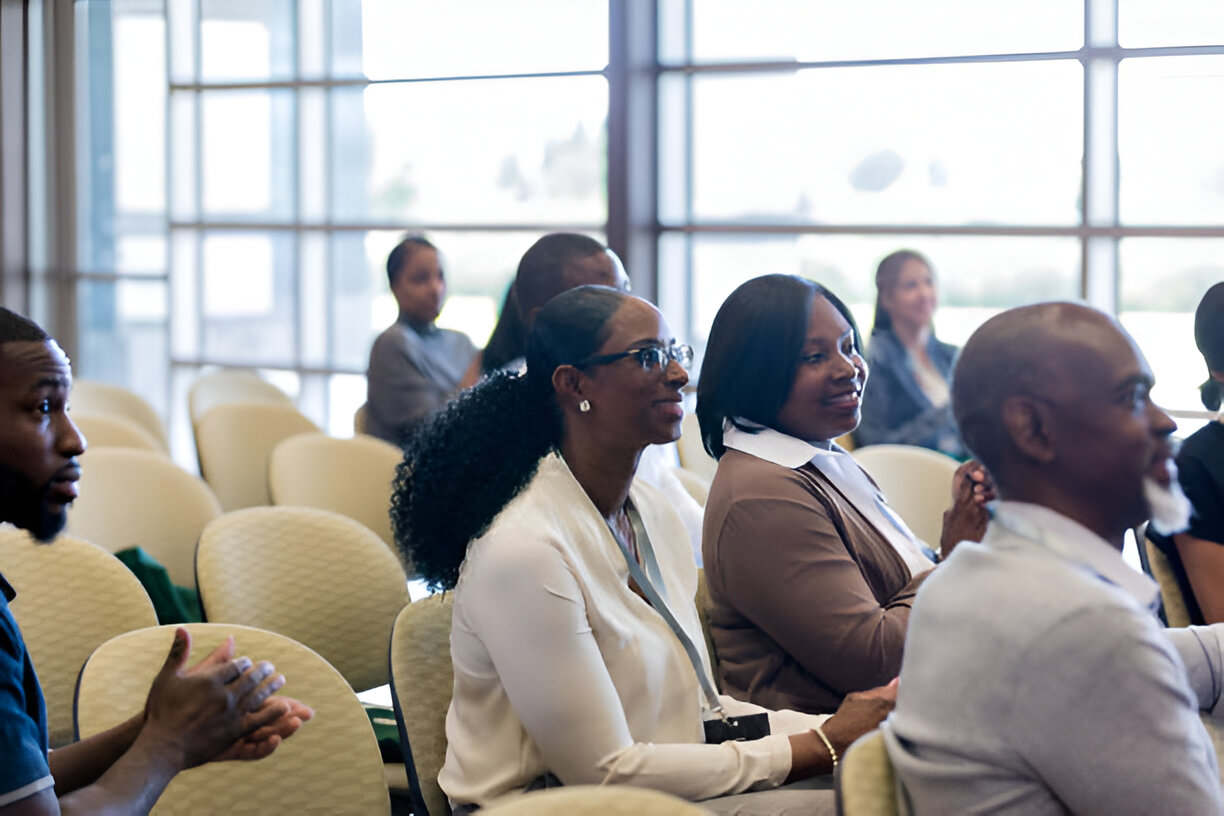 image showing Nigerian lady listening attentively in a seminar - Quintessential healthcare service